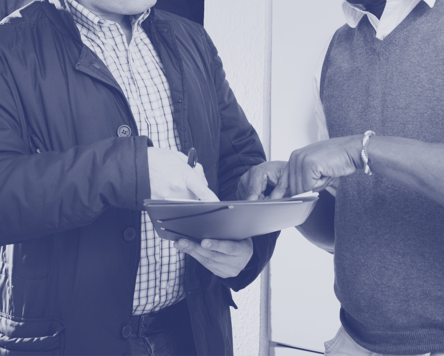 Two people reviewing paperwork
